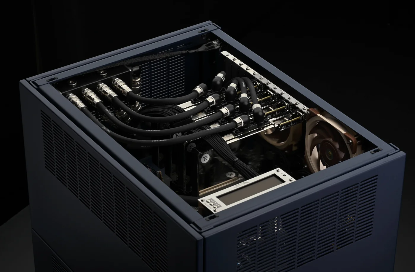Water-cooled GPUs in a WS.COMPUTER workstation: black tubing, nickel fittings and sleeved power cables